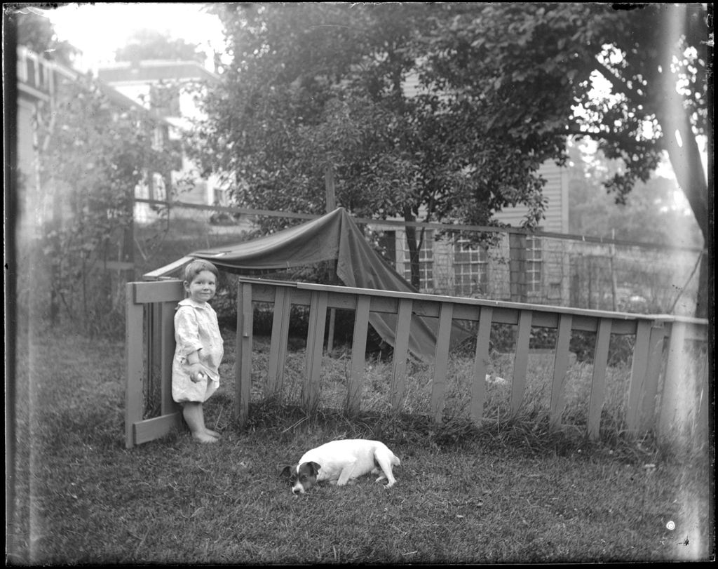 Miniature of Young Boy Outside With A Dog
