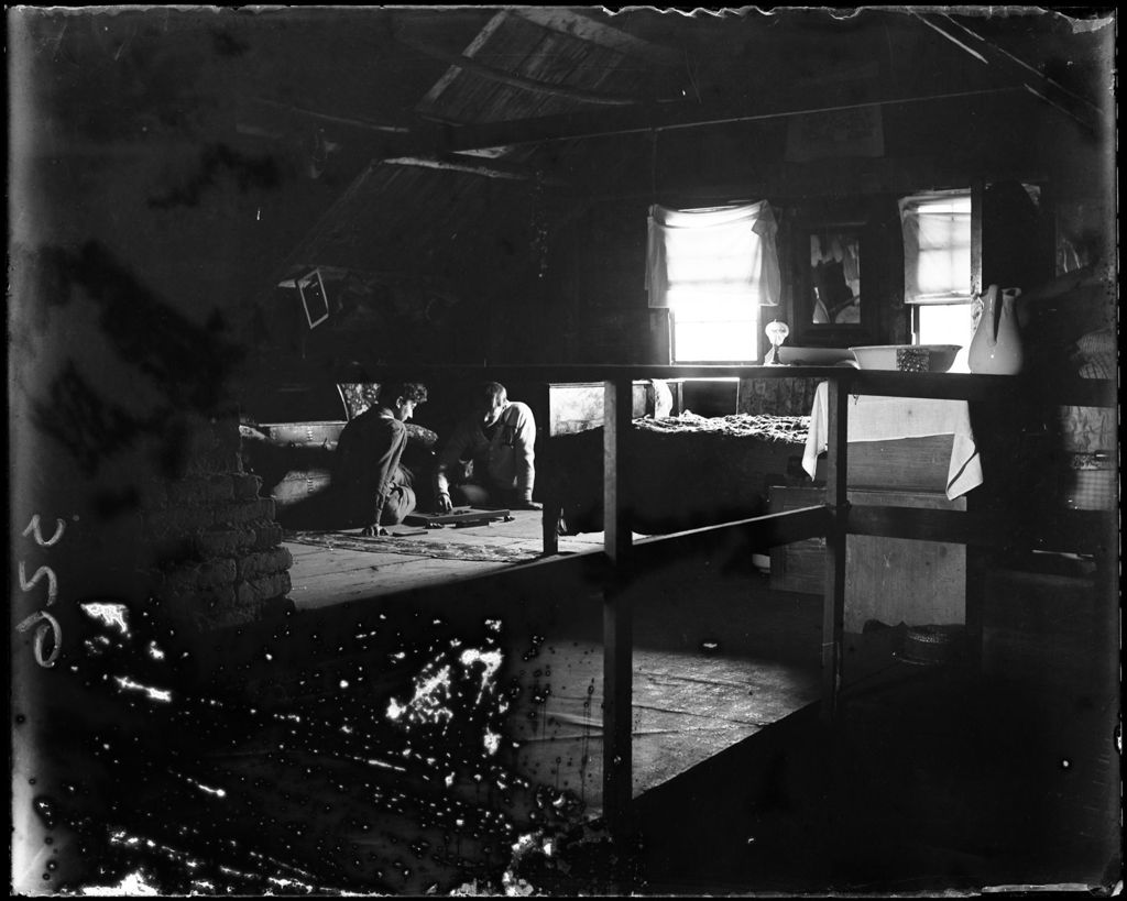Miniature of Two Young Men Playing Checkers In An Attic