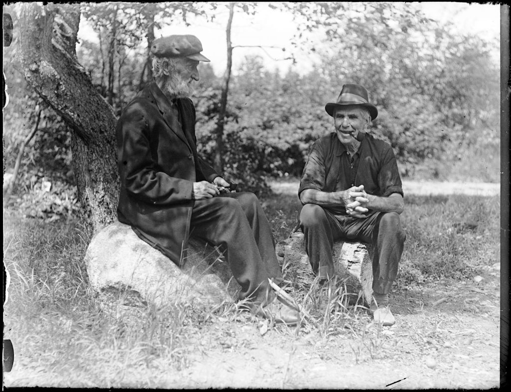 Miniature of Two Elderly Men Sitting Together Smoking Pipes And Talking