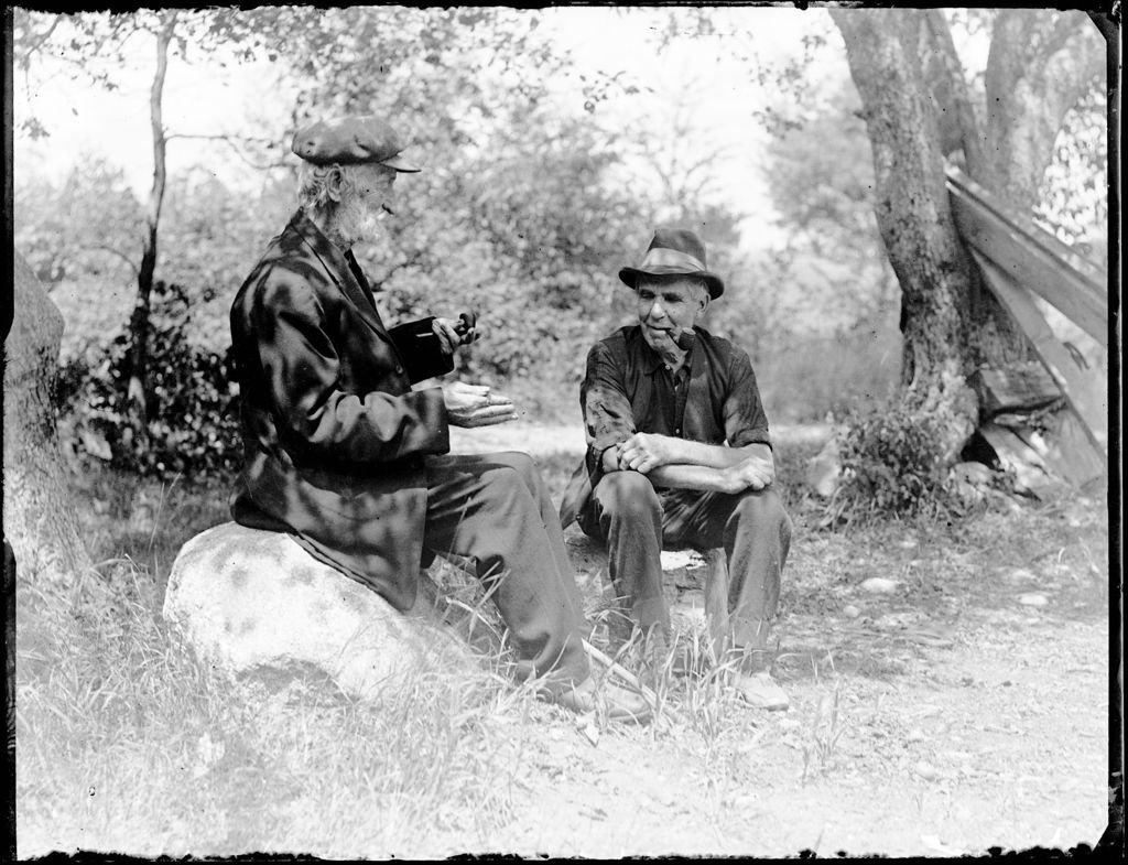 Miniature of Two Elderly Men Sitting Together Smoking Pipes And Talking