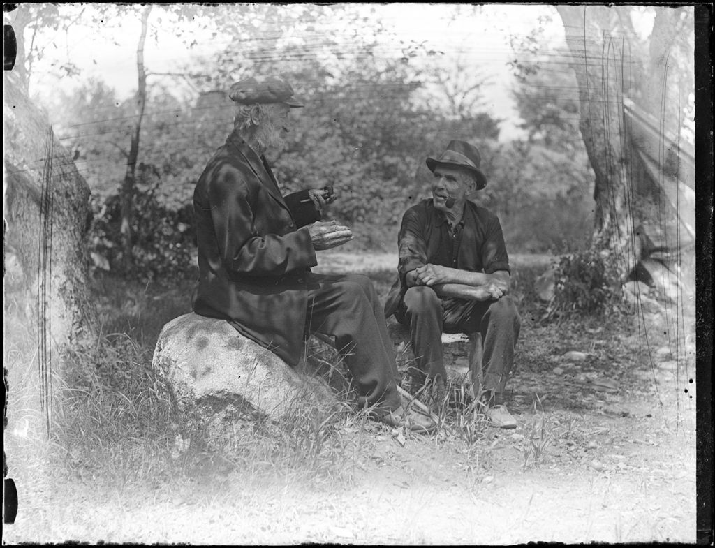 Miniature of Two Elderly Men Sitting Together Smoking Pipes And Talking
