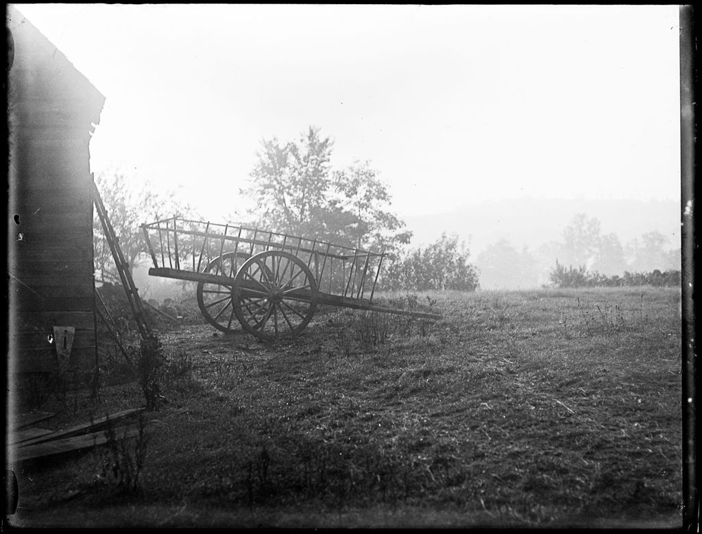 Miniature of View Of A Two-wheeled Hay Cart Sitting Outside Of A Barn