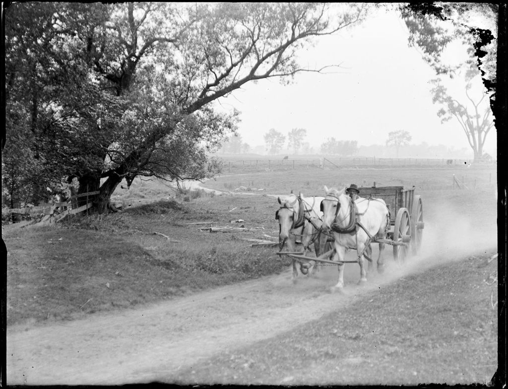 Miniature of Man Riding Down A Road With A Team Of Horses And Wagon Fryeburg