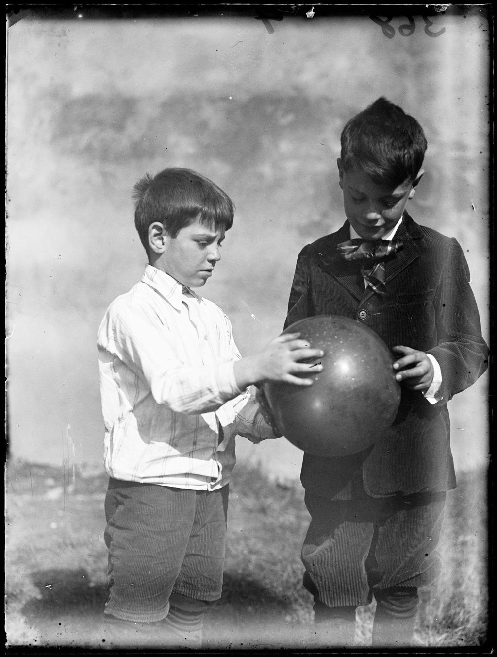 Miniature of Two Young Boys With A Balloon