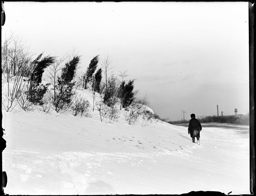 Miniature of Young Boy Walking Through The Snow