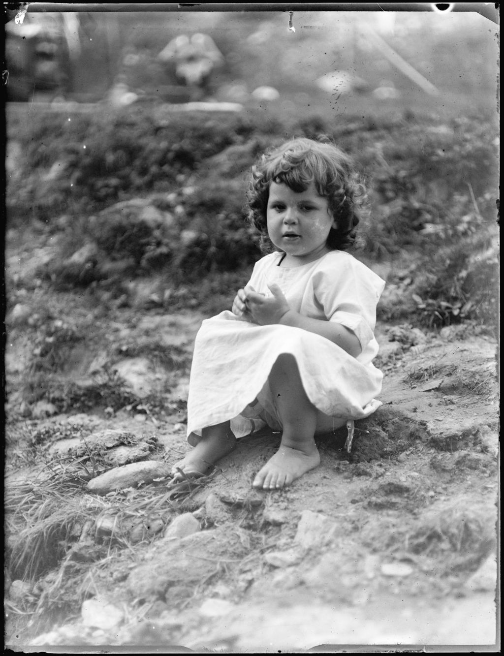 Miniature of Portrait Of A Young Girl Sitting On The Ground