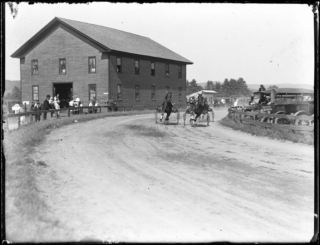 Miniature of Spectators Watching A Harness Race At A Fair