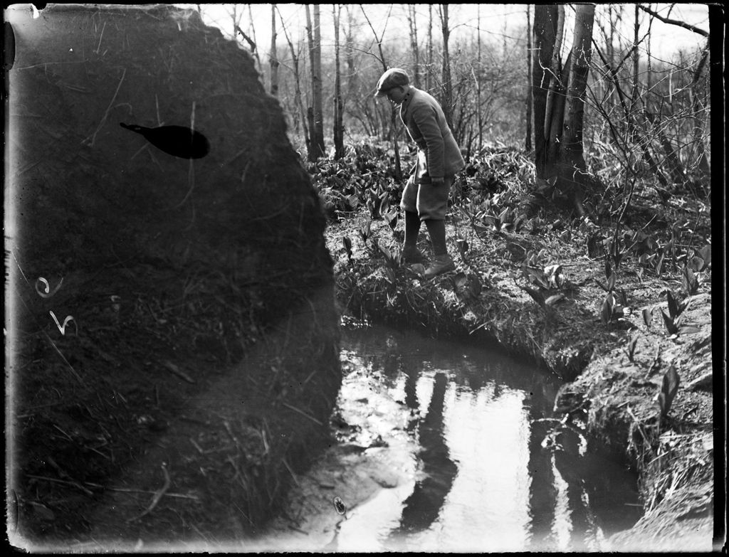 Miniature of Young Boy Standing At The Edge Of A Creek