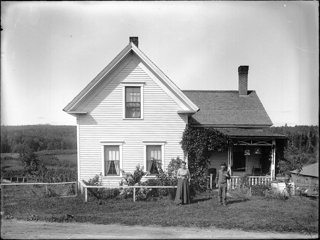 Miniature of Man and woman standing outside their rural, country home