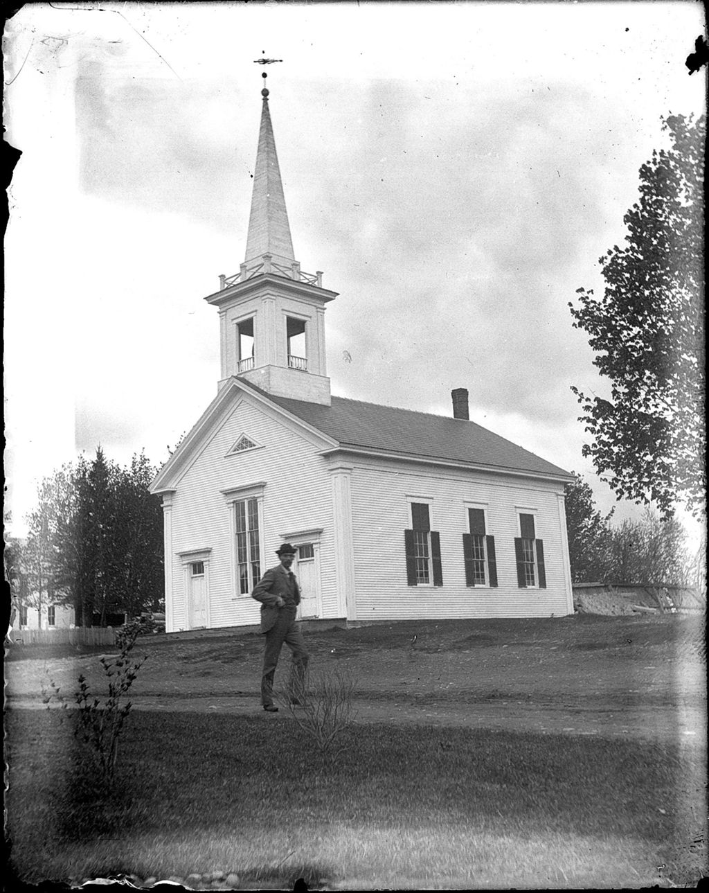 Miniature of Man walking past a rural church