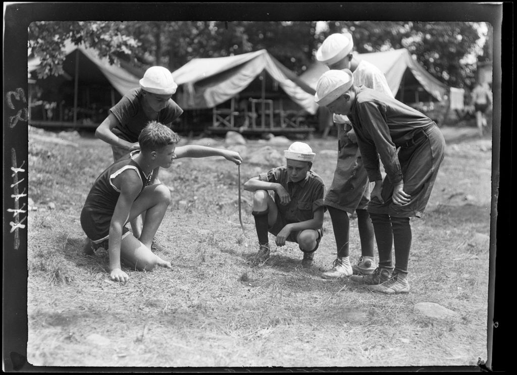 Miniature of Genre- Boy Scouts Gather Around While One Holds Snake