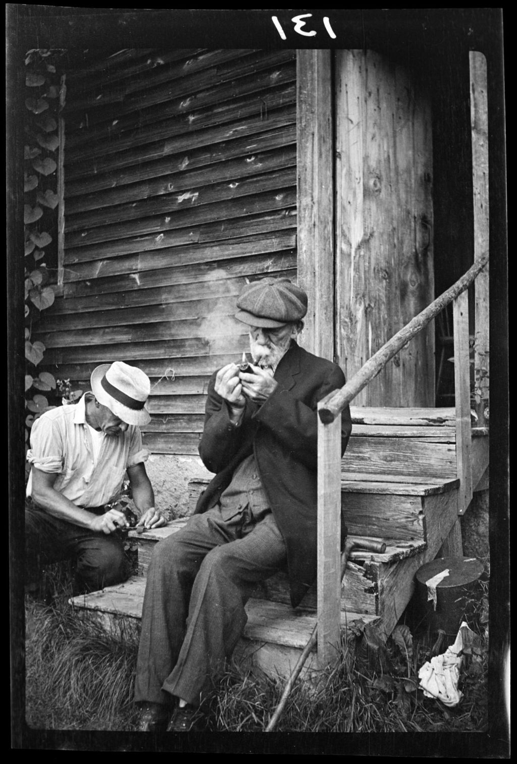 Miniature of Gransir Sit's On Steps, Smoke's Pipe
