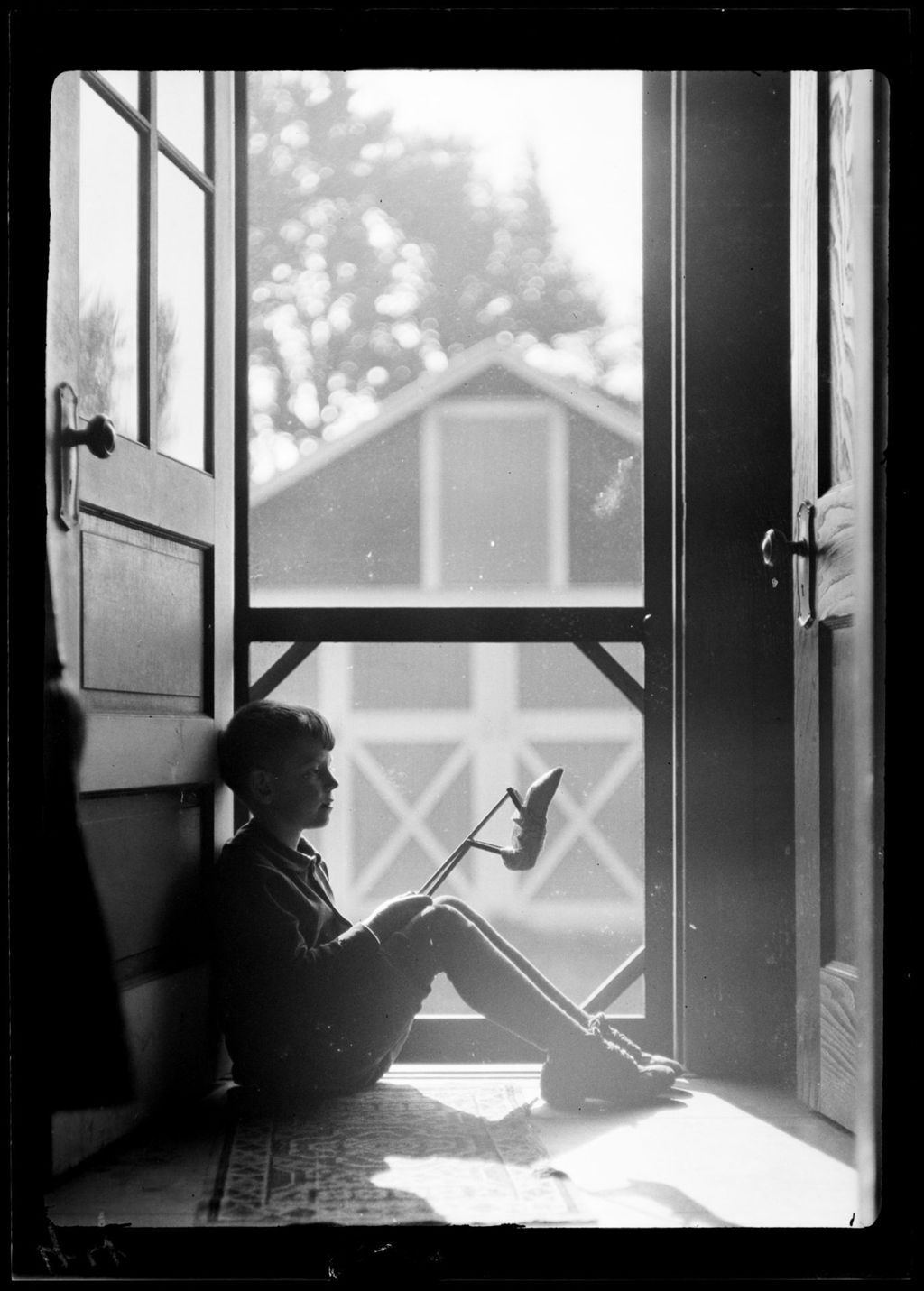 Miniature of Tots- Don Sits In Doorway With His Jumping Jack