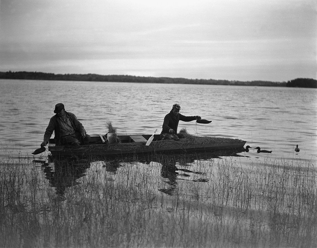 Miniature of Two Hunters Setting Decoys From A Camouflaged Boat In Merrymeeting Bay