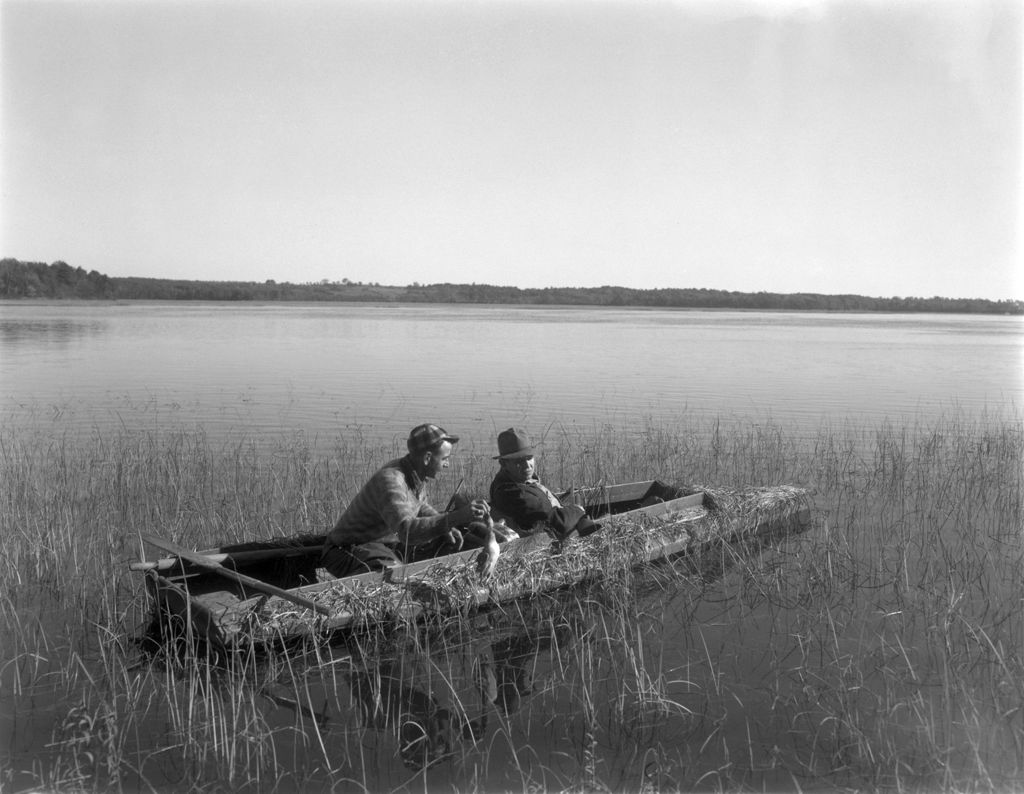 Miniature of Two Duck Hunters Sitting In A Camouflaged Boat