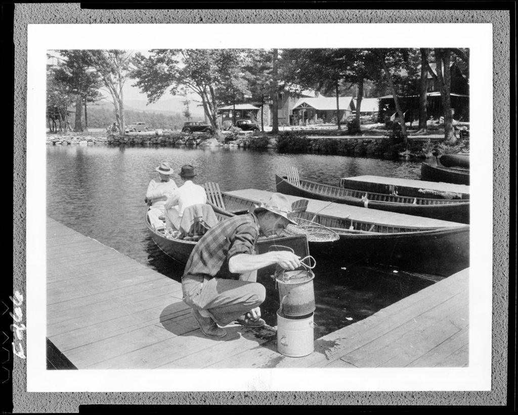 Miniature of Man On A Dock Preparing Live Bait For A Fishing Expedition