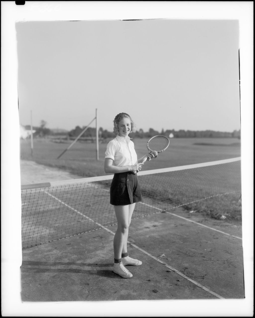 Miniature of Young Lady Outfitted To Play Tennis