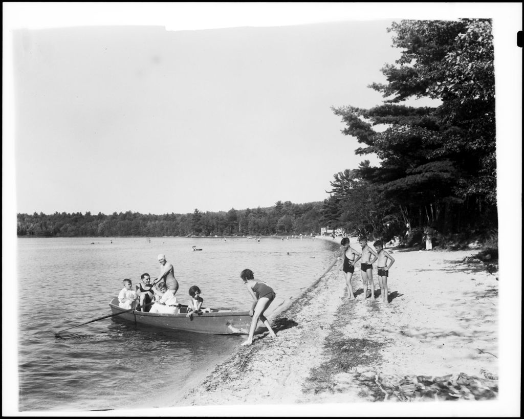 Miniature of A Family Out In A Boat Others Watching From Shore