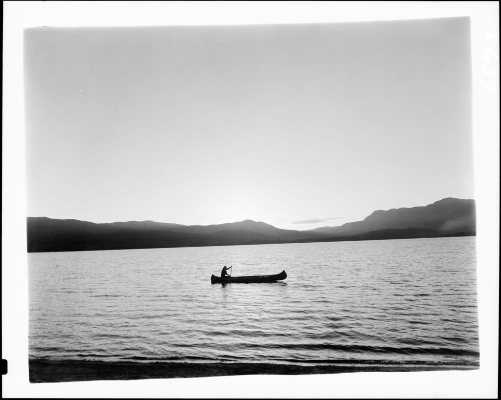 Miniature of Single Canoe On Lake At Sunset, Mountains In Distance In Weld