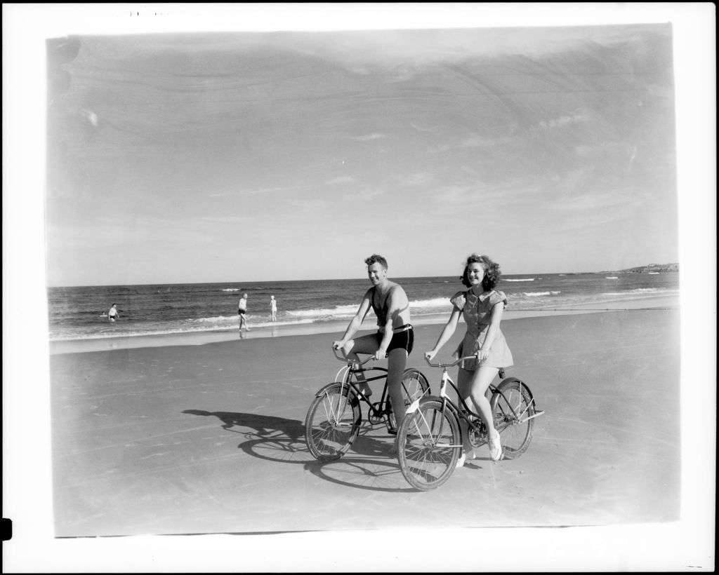 Miniature of A Couple Riding Bicycles On The Beach