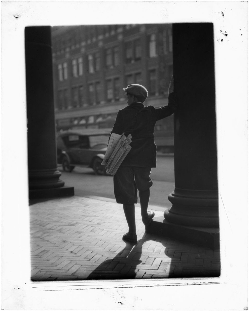 Miniature of Newsboy Selling Papers, Leans Against A Column On A City Sidewalk, Nj