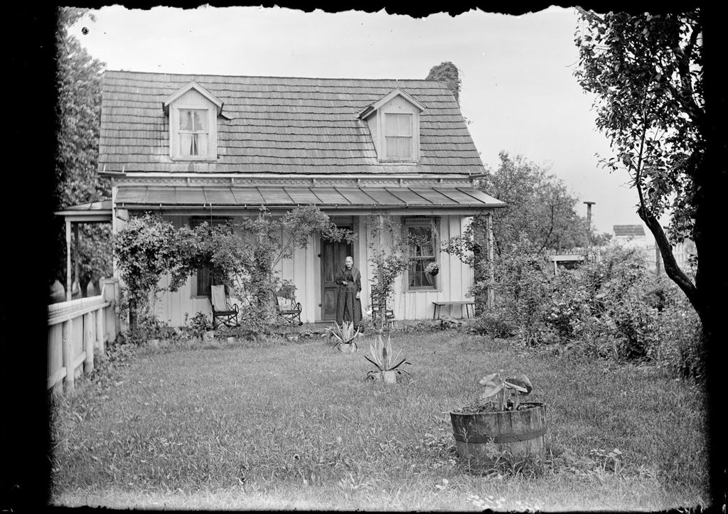 Miniature of Old Woman Standing On The Back Porch Of An Old Cape
