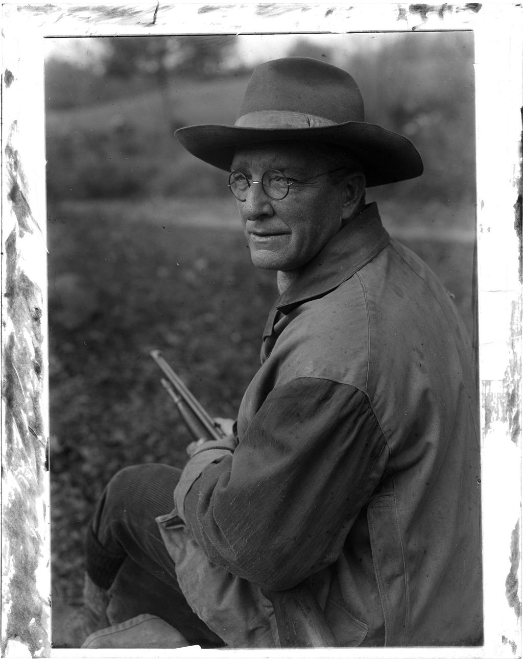 Miniature of Guide Bills Its Looking Past Camera With Rifle In His Hands
