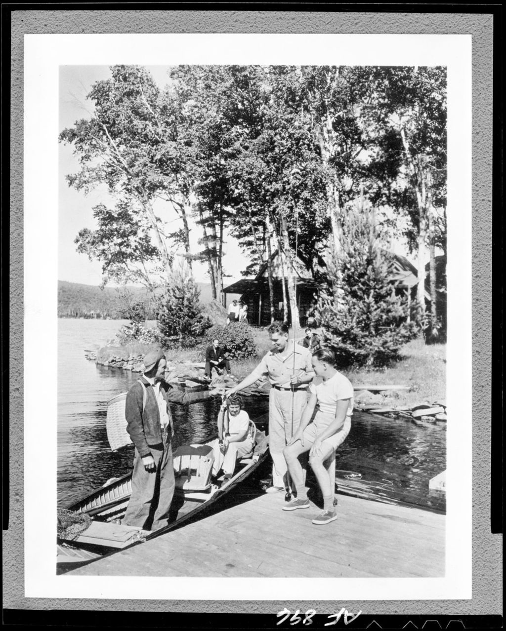 Miniature of Man And Woman In Boat Showing Days Catch To Two Men On Dock At Pleasant Island Camps, Rangeley