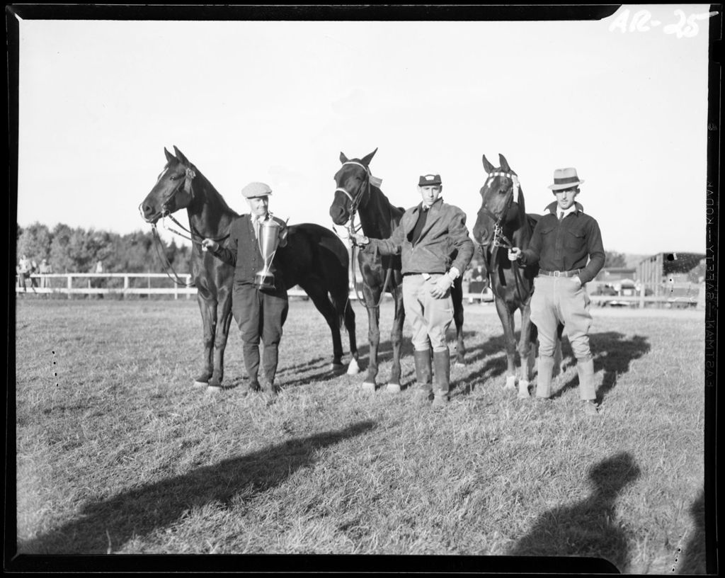 Miniature of Three Men Standing Beside Horses, One Man Is Holding A Trophy