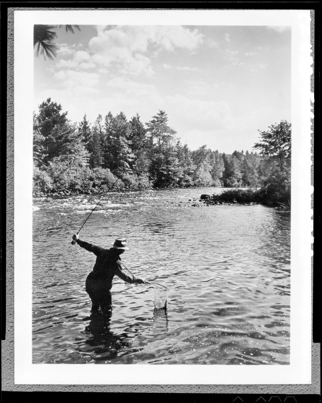 Miniature of Man Standing In Stream Netting Fish