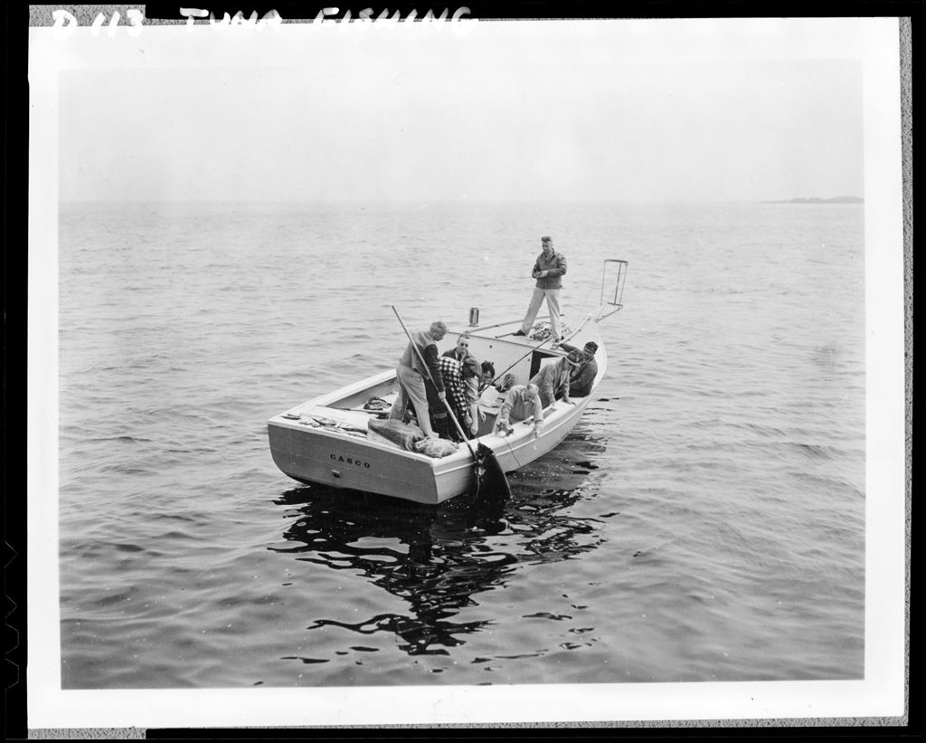 Miniature of Fisherman Gaffing A Tuna And Hauling It Aboard A Boat