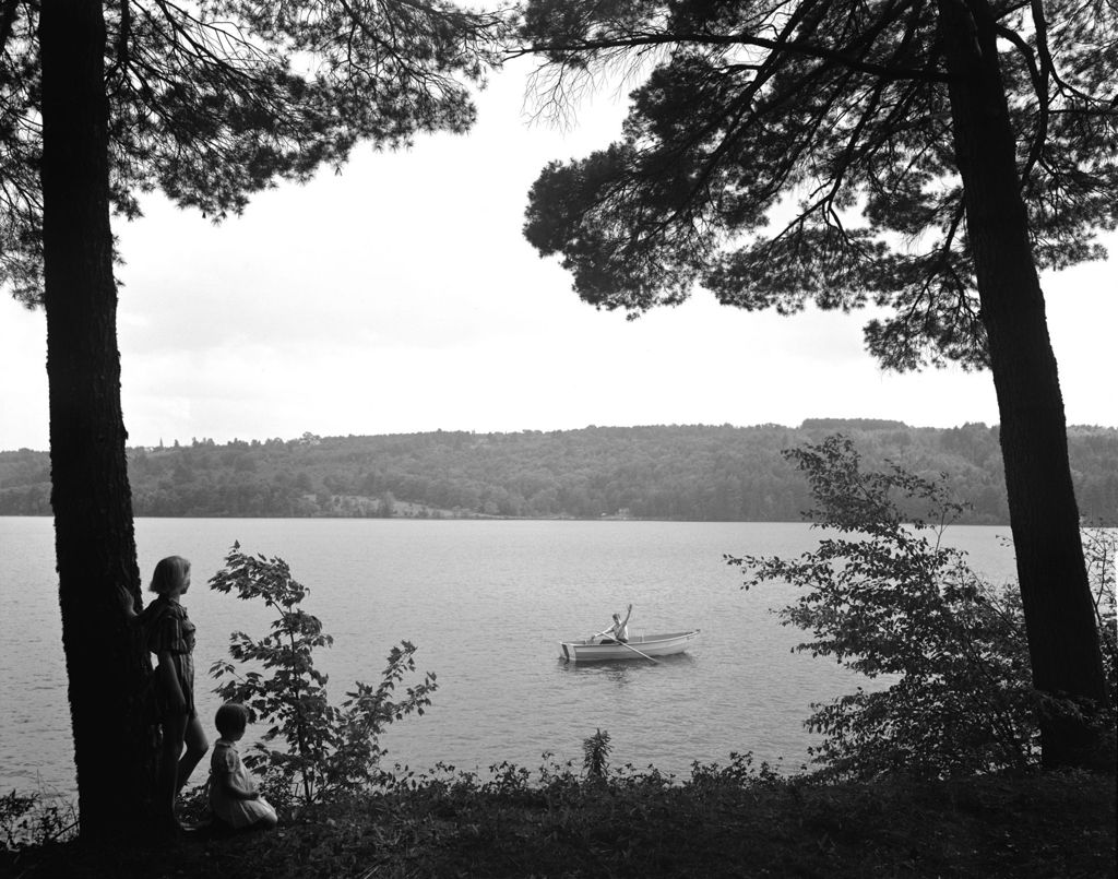 Miniature of A Man In A Boat Waving To His Family On Shore