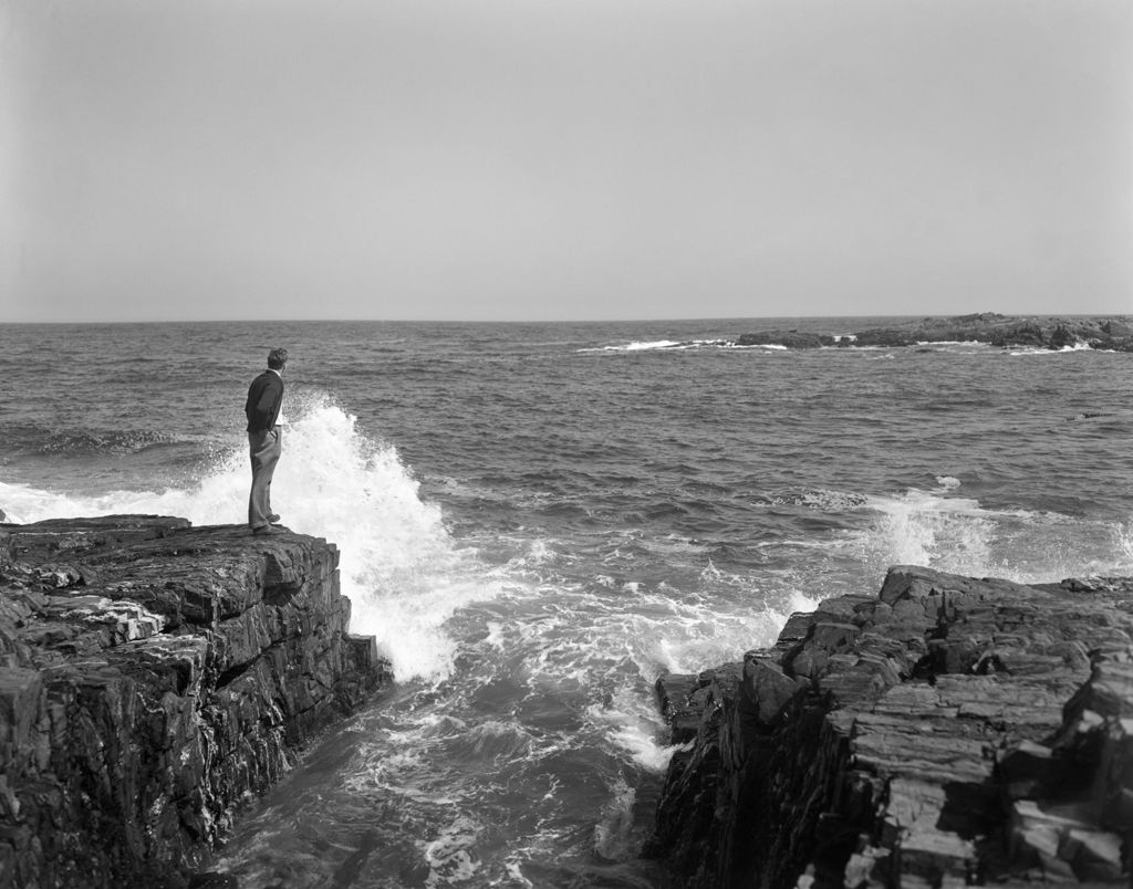 Miniature of Man Standing On A Rocky Shore