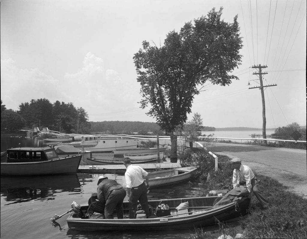 Miniature of Three Men Launching A Boat